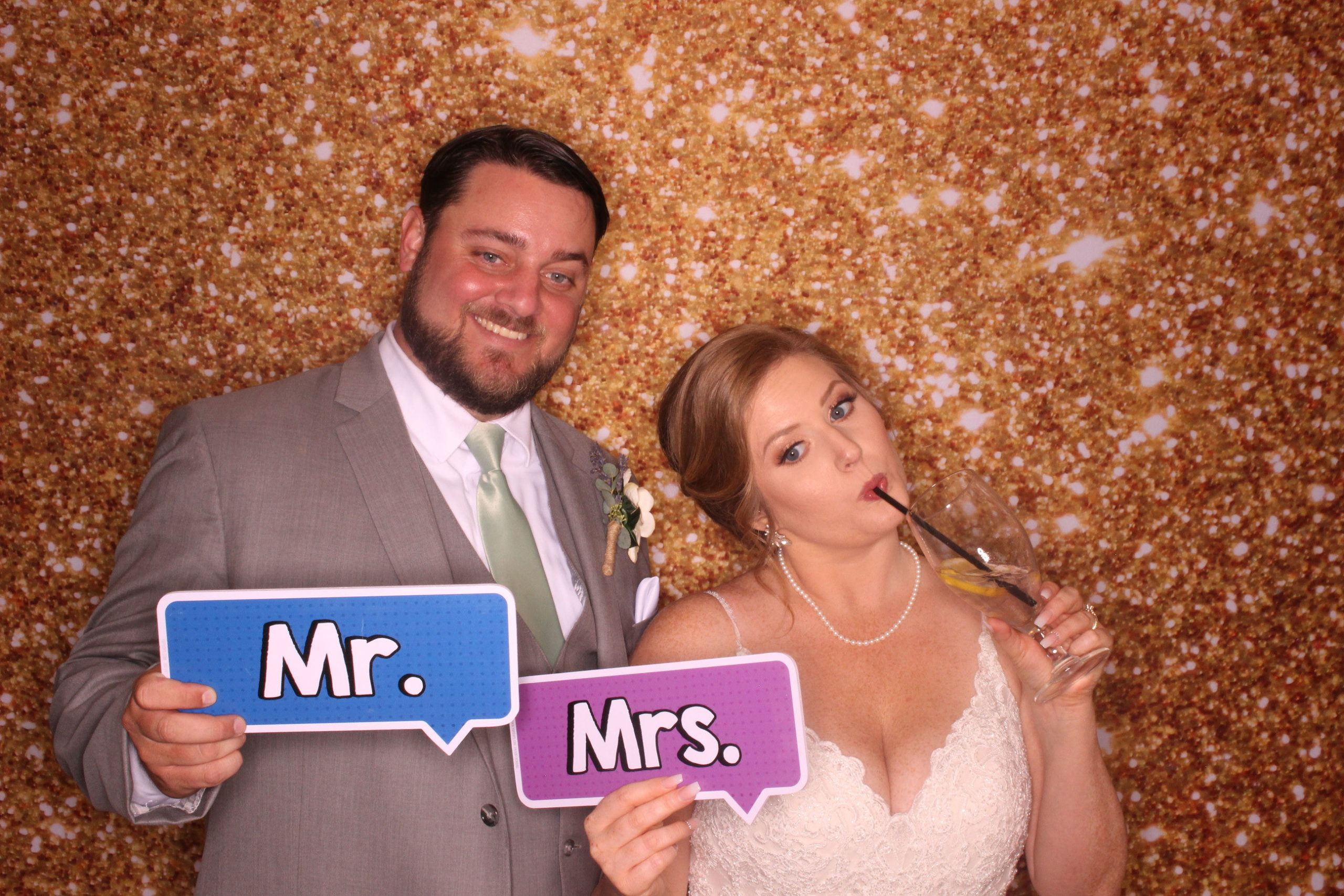 Bride and Groom pose in photo booth
