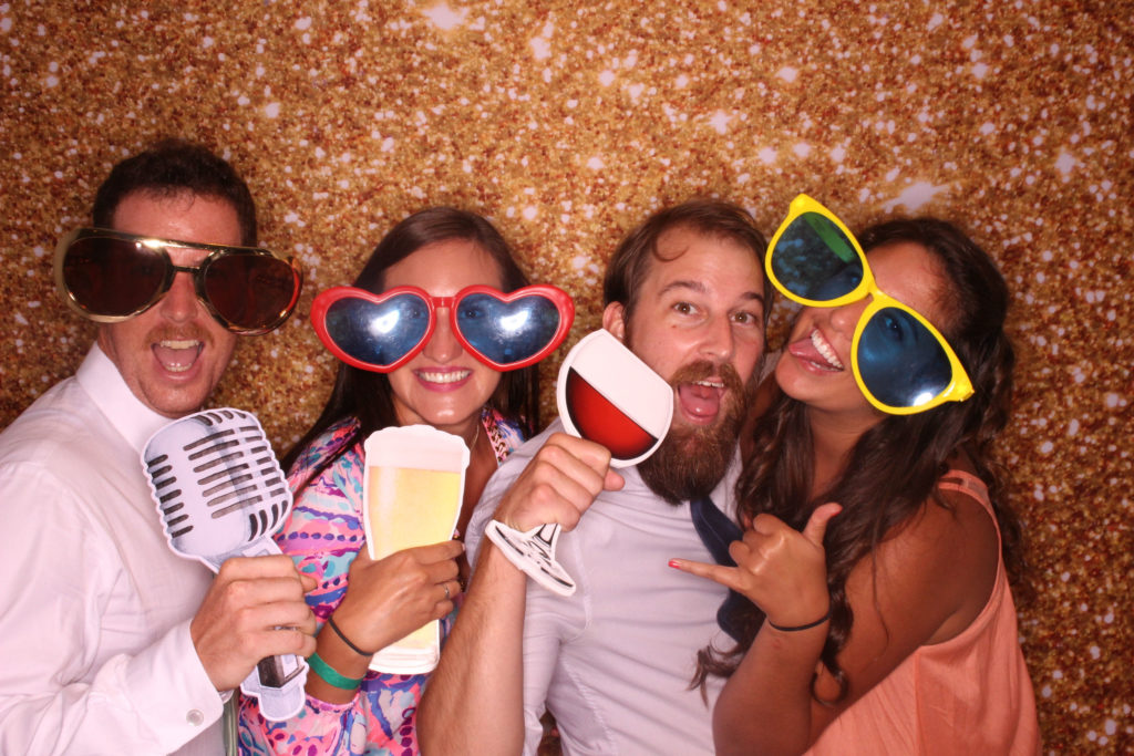 wedding guests posing in photo booth