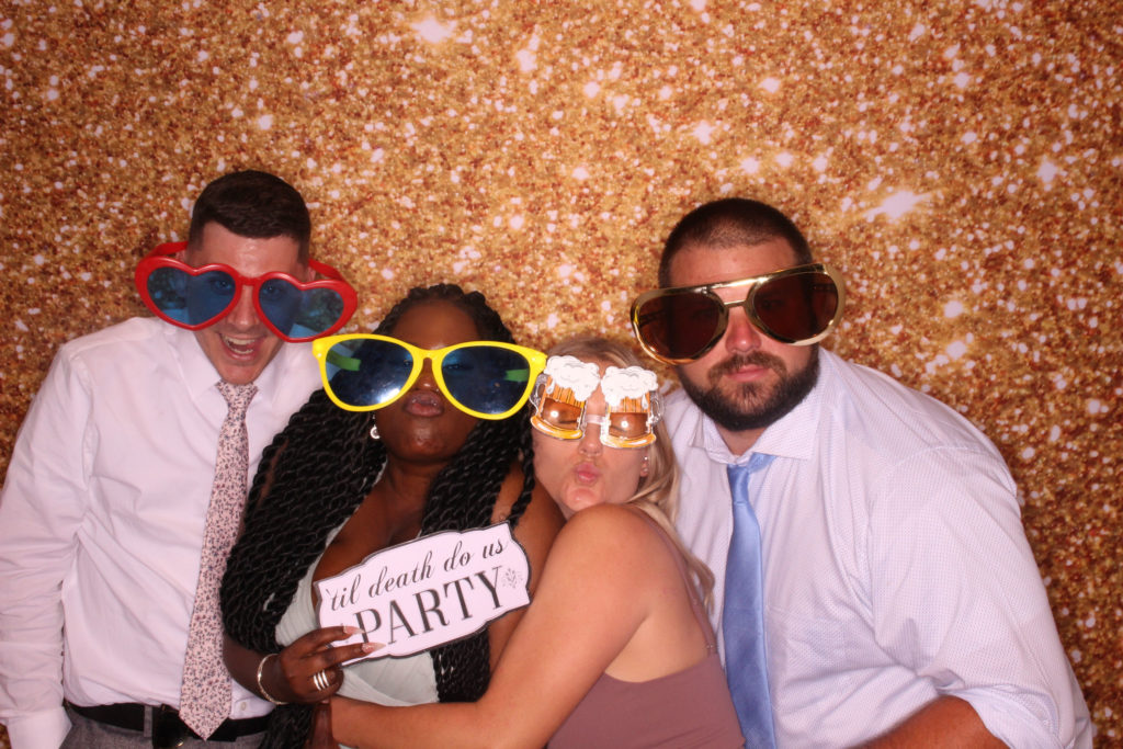 wedding guests posing in photo booth