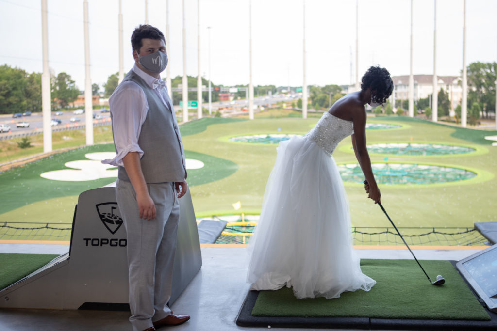 bride and groom golfing